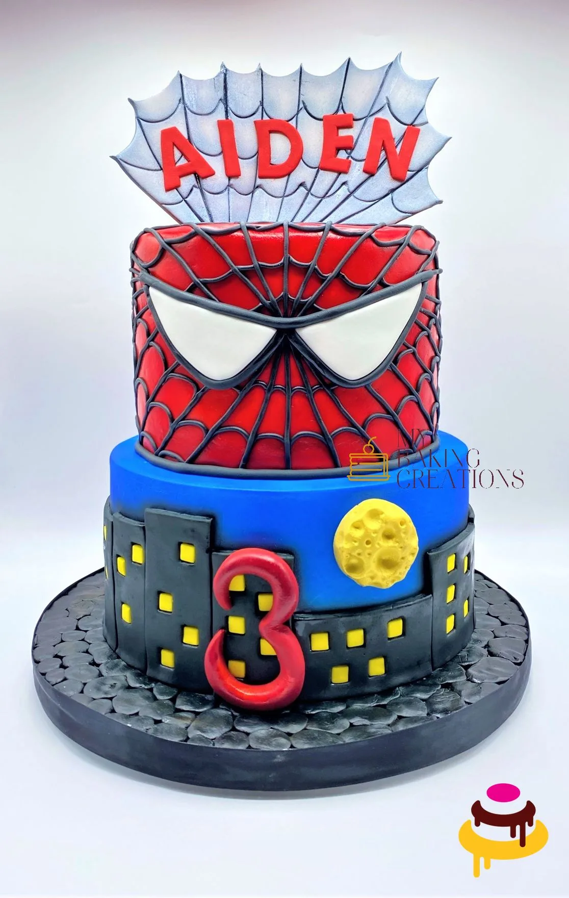Custom Spider-Man cityscape tiered birthday cake Bay Area bakery